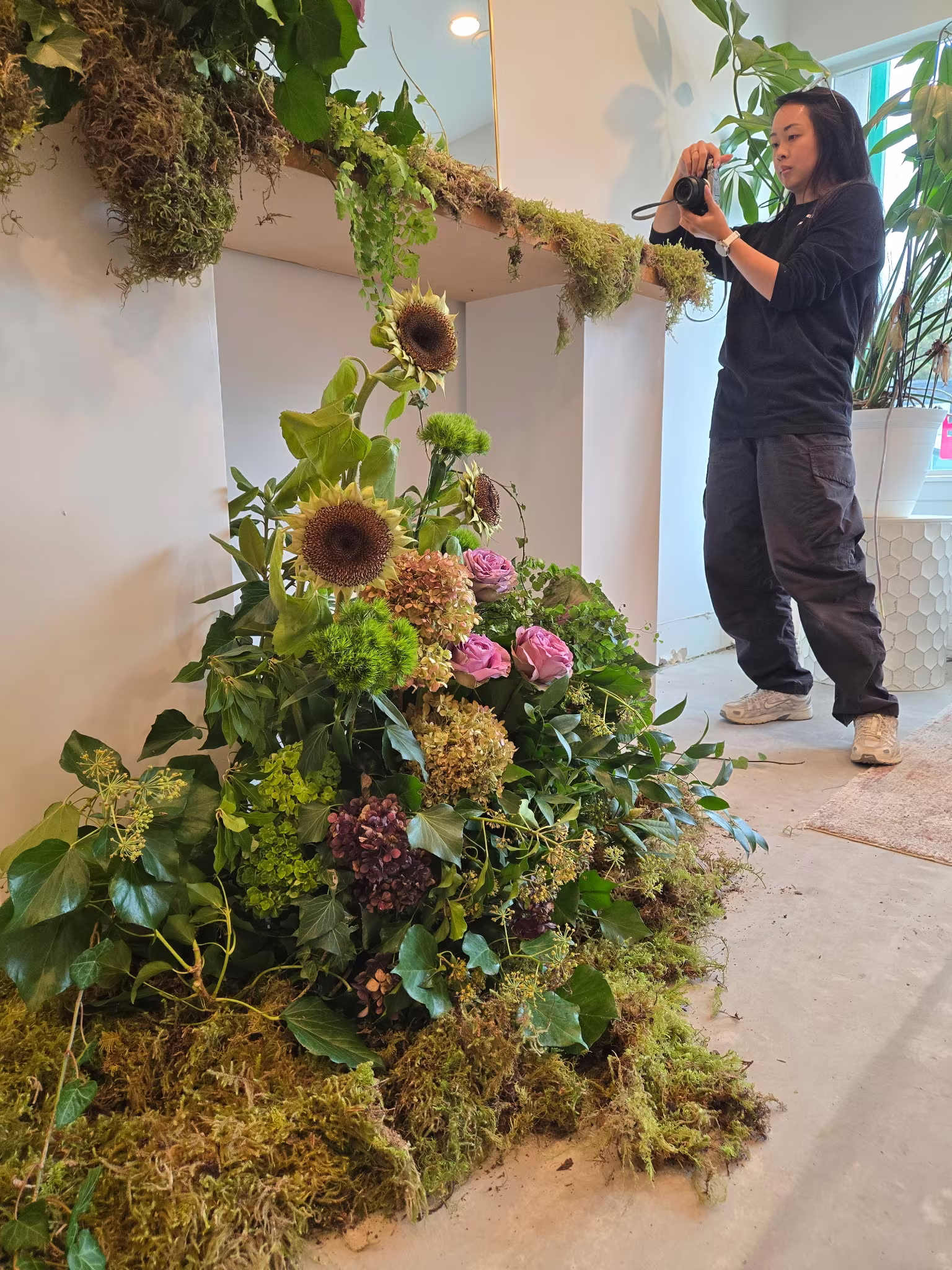 Sunflower and hydrangea ceremony pillar on a moss base