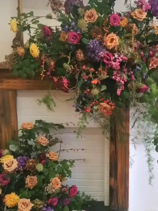 Floral mantel installation with garden roses and dahlias