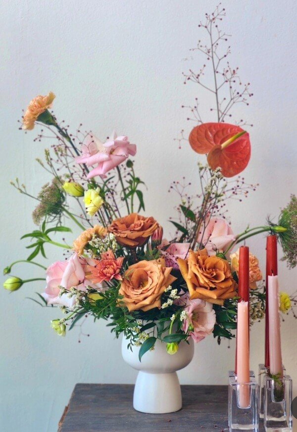 Garden style table arrangement with anthurium and candles