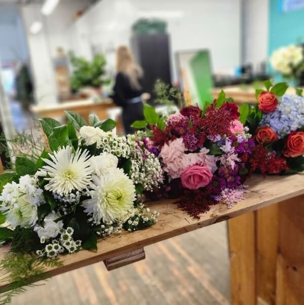 Fresh florals lined up on the workshop table