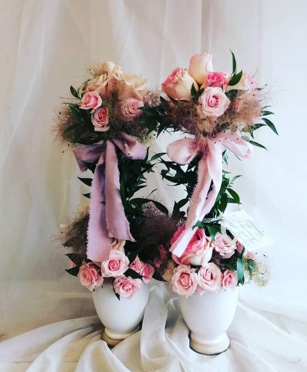 Topiary tree embellished with foliage and satin
